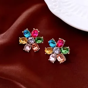 Vintage floral stud earrings with multi-color rhinestones in a luxury gold setting