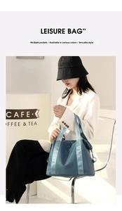 Detail of blue nylon crossbody bag with reinforced handles and wide strap for casual wear