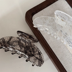 Medium lace pattern hair claw clips in black and white with vintage resin texture