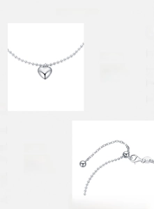 Macro detail of S925 sterling silver heart pendant and polished bead chain clasp