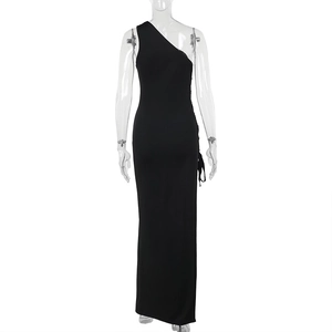 Detail of elegant black one-shoulder maxi dress with side slit and slim fit silhouette