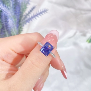Blue-purple rectangular radiant cut s925 silver ring on hand with small side stones