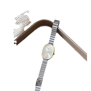 Elegant oval dial quartz watch with silver stainless steel mesh strap for women
