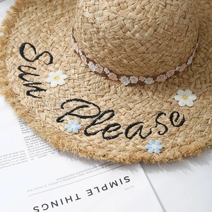 Handwoven raffia sun hat with Sun Please embroidery and floral patches for beach vacation