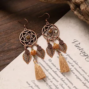 Vintage bohemian dreamcatcher earrings with metal leaf, wooden beads and beige tassels