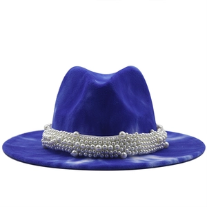 Detail of blue marble wool fedora hat featuring multi-layer pearl crown embellishment
