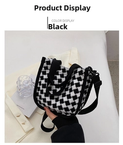 Detail of mini black and white houndstooth crossbody bag with handles and strap