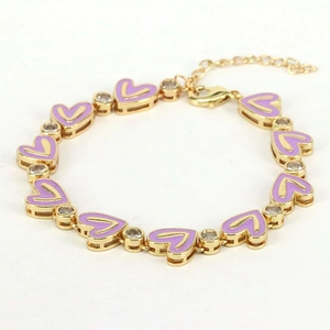 Detail of gold-plated bracelet featuring purple enamel hearts and sparkling zircon stones