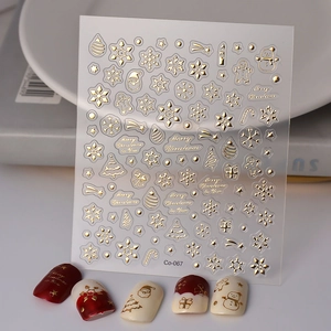 Detailed 5D gold embossed Christmas nail stickers featuring snowflakes and snowman designs