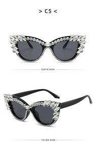 Detail show of cat eye sunglasses with rhinestones and crystal inlay for party