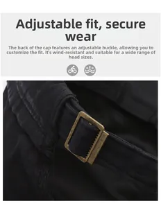 Detail of adjustable metal buckle and black cotton twill fabric on a military style flat cap