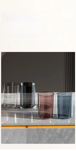 Modern minimalist large capacity toothbrush cups in four colors on marble countertop