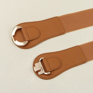 Detail of brown elastic waist belt with gold interlocking metal buckle and PU leather ends