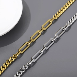 Macro shot of minimalist hollow chain bracelet in gold and silver stainless steel