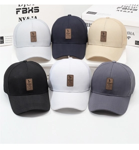 Collection of waffle knit baseball caps in six colors with vintage leather logo patches