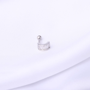 Detailed macro view of 16G silver stainless steel U-shaped cartilage stud with zircons