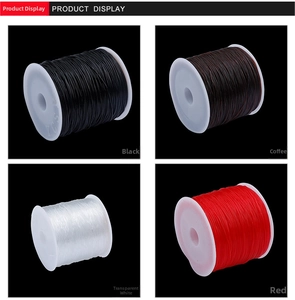 Strong elastic crystal cords in black, coffee, white, and red on white plastic spools