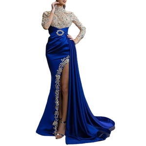 Detailed embroidery and crystal accents on a royal blue evening gown with a high slit