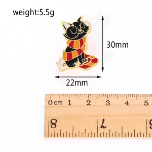 Cartoon black cat metal pin with red scarf including size markers and scale