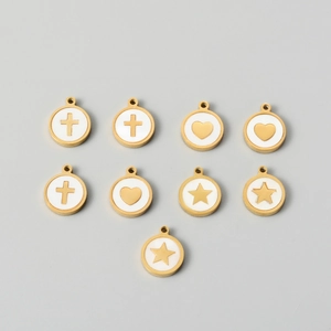 Detailed view of golden stainless steel shell pendants with enamel heart, star and cross