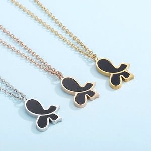 Three butterfly pendant necklaces in silver, rose gold, and gold on blue background