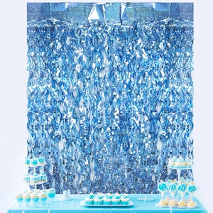 Blue foil fringe curtain background with wavy texture for ocean themed party decorations