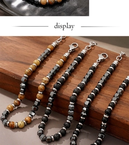 Detailed view of beaded bracelets with natural agate, lava rock and adjustable clasp