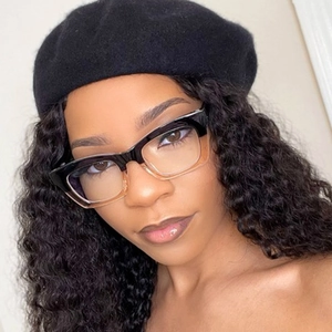 Close-up of retro square cat-eye glasses with black and transparent color-block frame