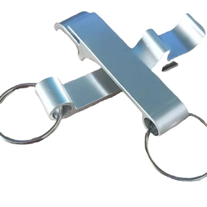 Two silver metal multifunctional beer bottle opener keychains crossed on white background