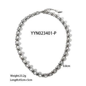 Detail of beaded stainless steel necklace showing lobster clasp and extension chain