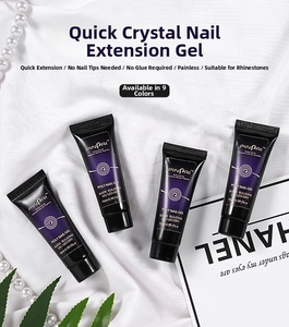 Flat lay detail of 15ml UV LED nail extension gel tubes on white fabric with pearls