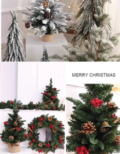 Detailed view of mini snowy Christmas trees with red berries and pine cones