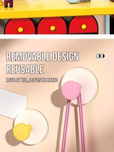 Detail of colorful suction hooks showing removable design for easy home wall organization