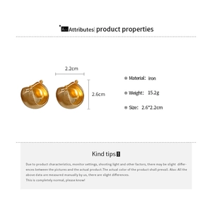 Detailed view of golden U-shaped chunky hoop earrings with size measurements