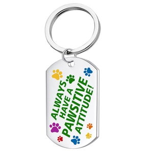 Stainless steel pet ID tag with Always Have a Pawsitive Attitude text and paw prints