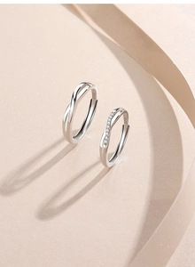 Detailed close-up of S925 sterling silver Mobius rings with sparkling crystal accents