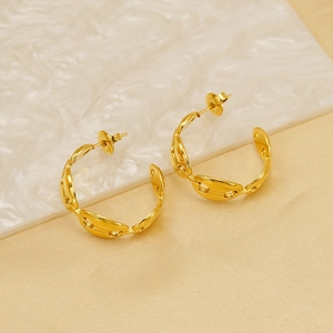 Polished gold titanium steel pig nose link hoop earrings shown from a 45-degree angle