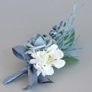Blue silk rose boutonniere for wedding groom with berries and ribbon from 45-degree angle