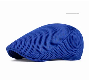 Detailed close-up of navy blue mesh fabric on a breathable flat cap for summer wear