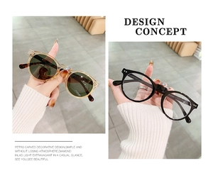 Detail view of round retro frames with rice nail accents in amber and black finishes