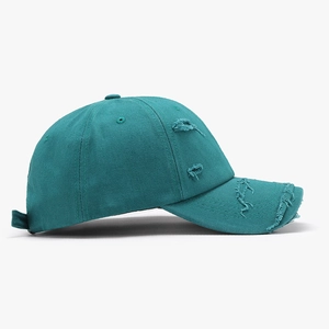 Vintage washed teal cotton baseball cap with distressed rip details for outdoor styling