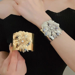 Detail of floral cuff bracelet featuring multilayer petals and a pearl center