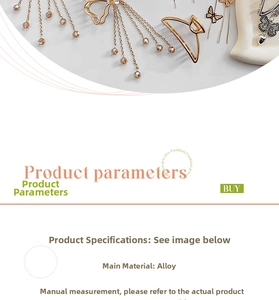 Macro shot of gold butterfly hair claw with hollow metal wings and dangling tassel detail