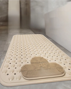 Detail of beige non-slip bathroom mat with massage texture and eco-friendly TPE rubber