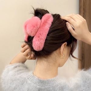 Pink plush faux fur shark hair claw clip for elegant updo hairstyles in autumn and winter
