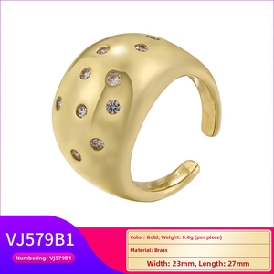 Detail of 23mm wide gold brass ring with embedded cubic zirconia stones and specifications