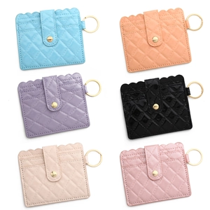 Quilted faux leather card holders in six vibrant colors with gold metal key rings