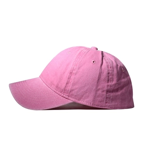 Close-up of pink washed cotton baseball cap showing 6-panel structure and vent holes