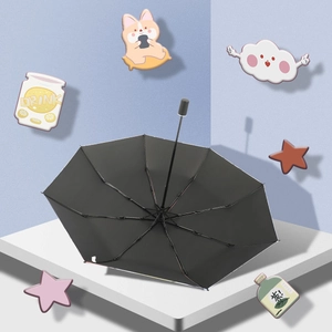 Cute cat themed black folding sun umbrella with UV protection on a geometric platform
