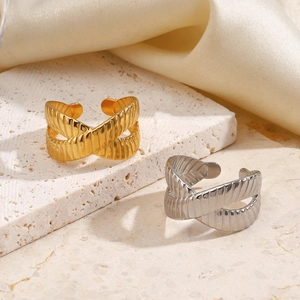 Minimalist geometric cross ring set with textured steel finish on white stone